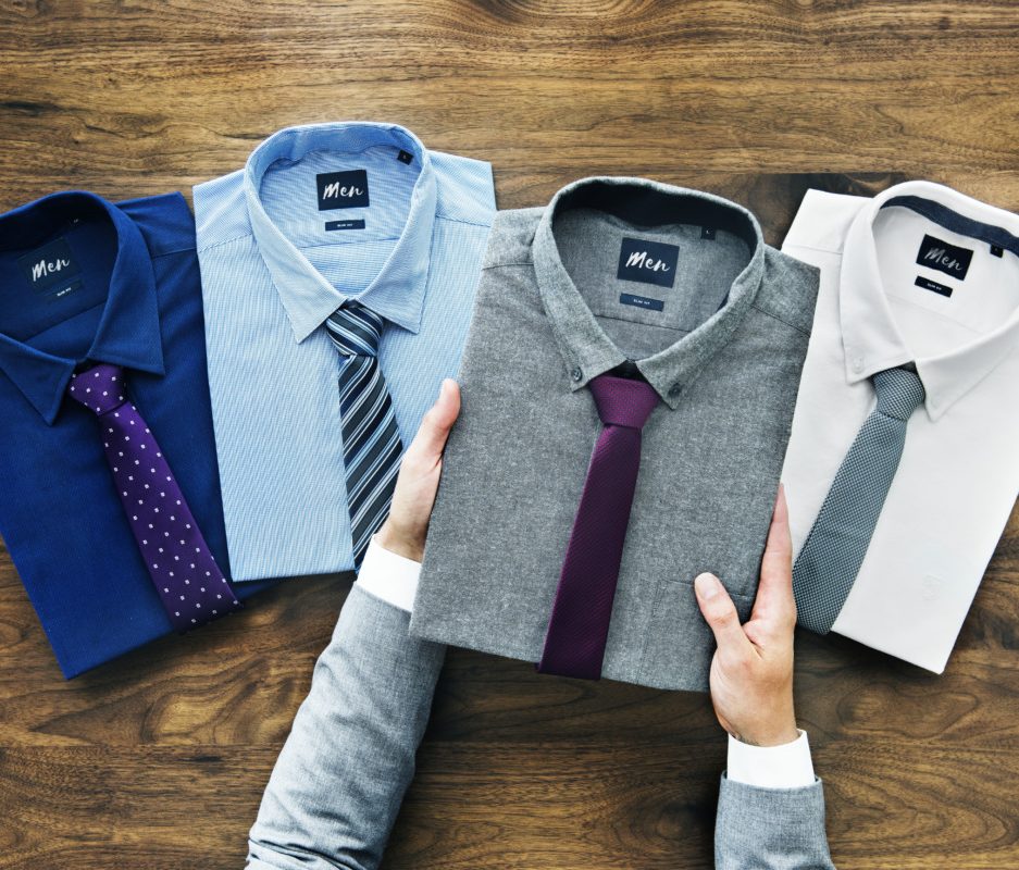 Businessman selecting shirt to wear